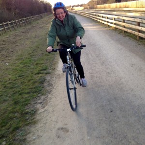 Rachel cycling on the Busway