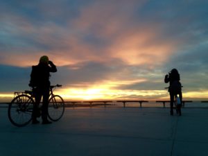 Cyclists at sunrise Barcelona